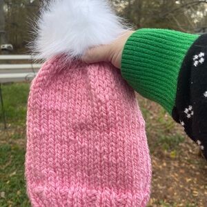 Hand knit beanie with faux fur pom pom